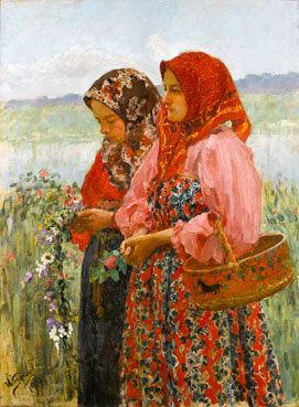 Two young girls gathering flowers